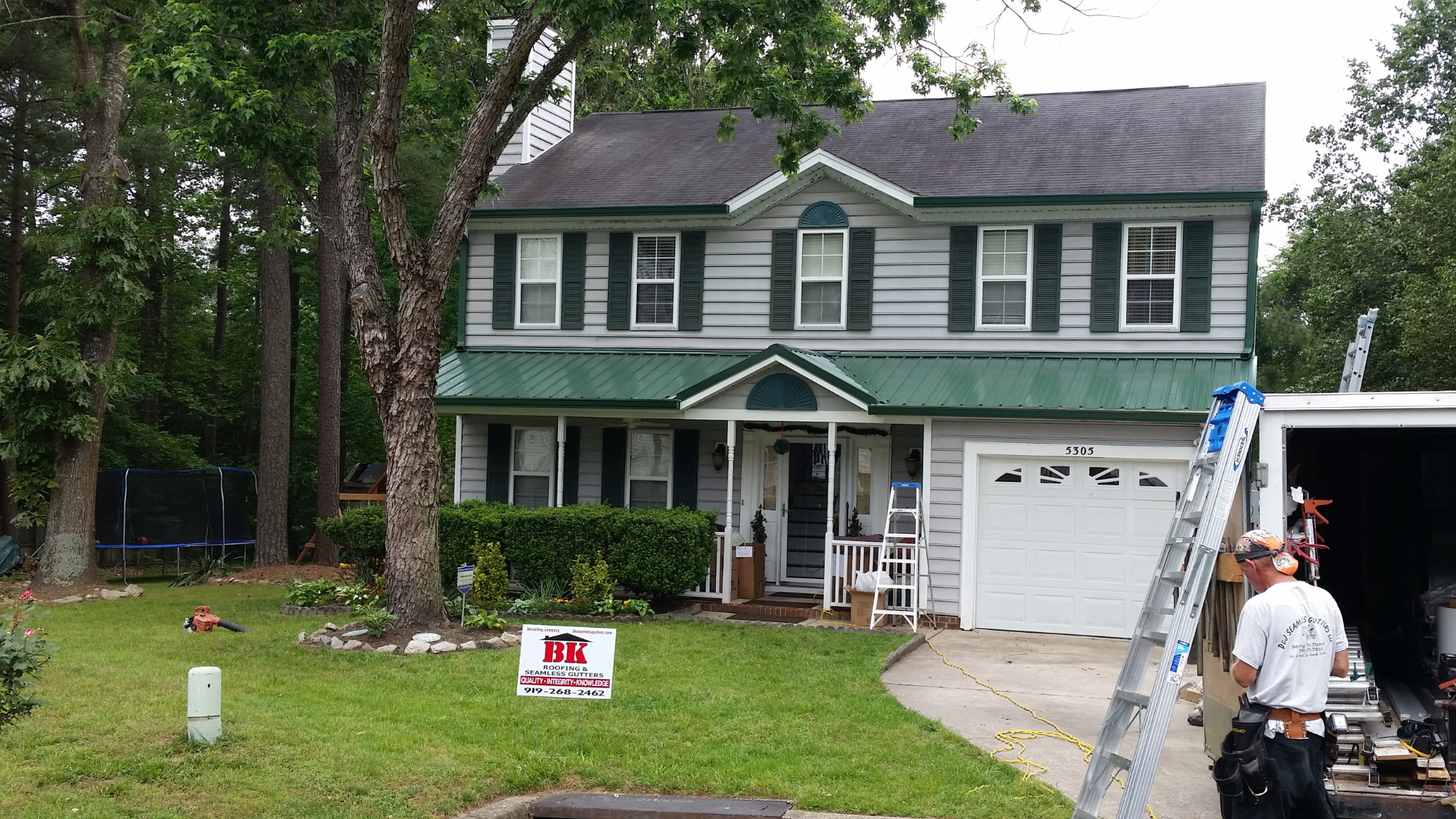 Full residential roof replacement in progress showing new shingle installation