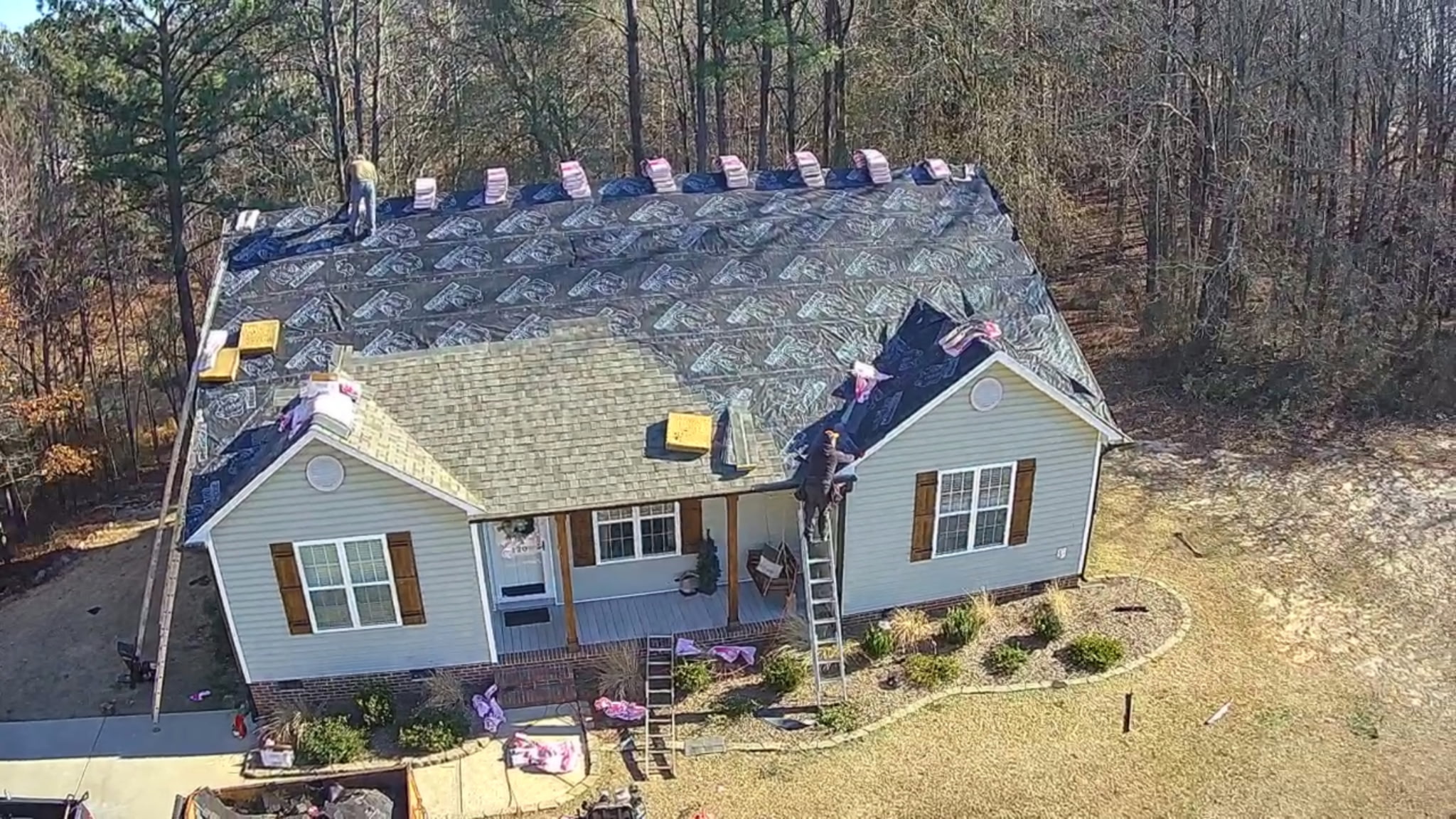 BK Roofing inspector performing a detailed roof inspection in Wake County, NC