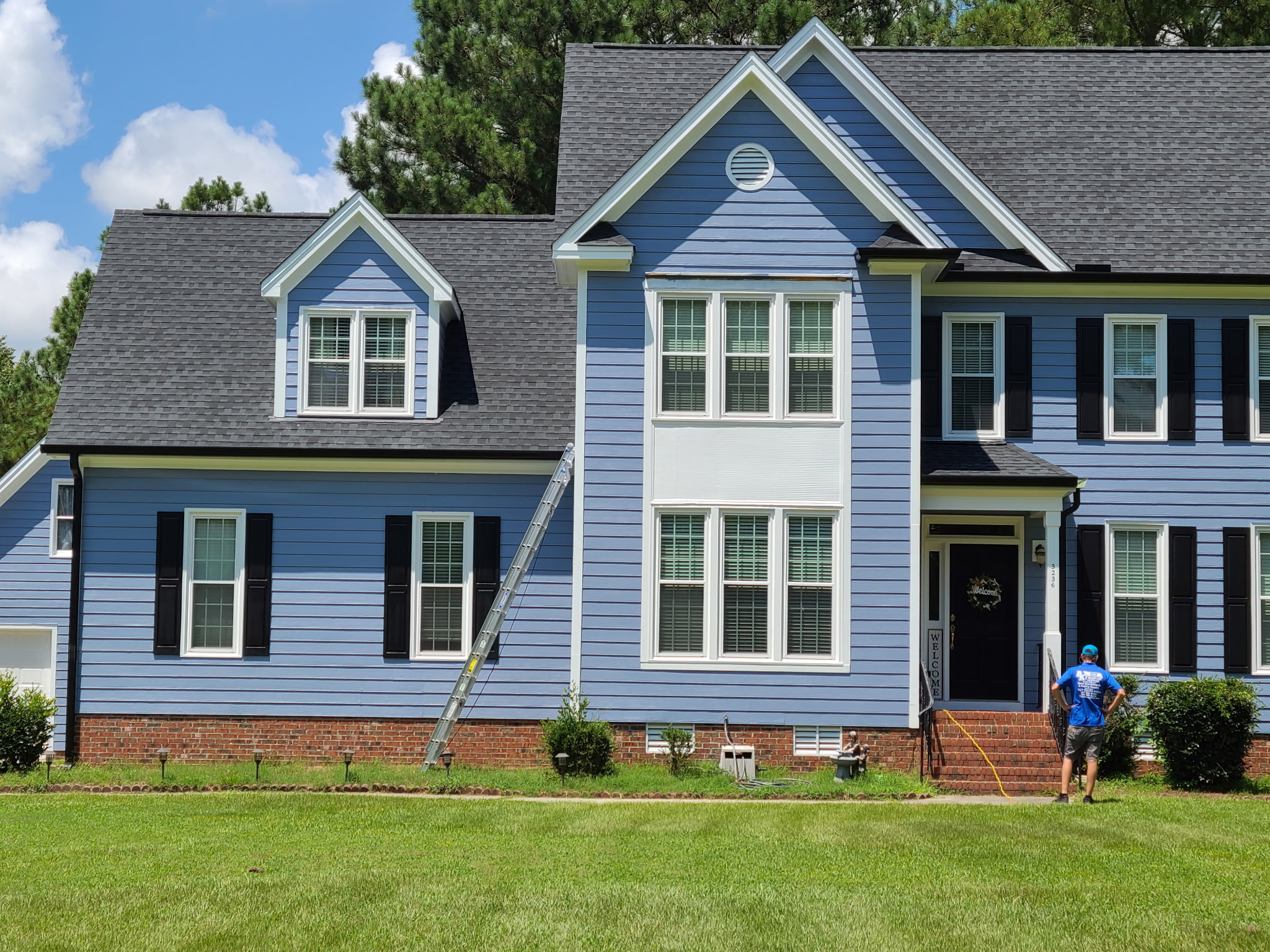 Experienced BK Roofing crew installing roof tiles with precision