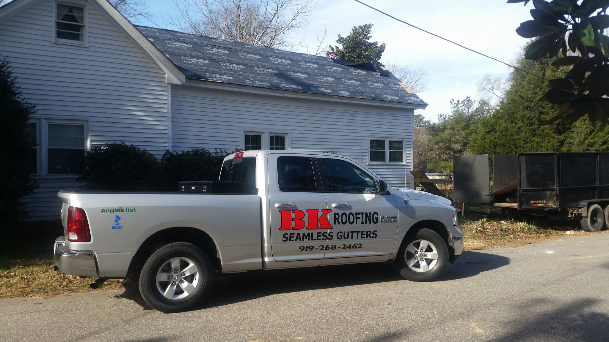 BK Roofing crew installing architectural shingles on a residential home in Wake 