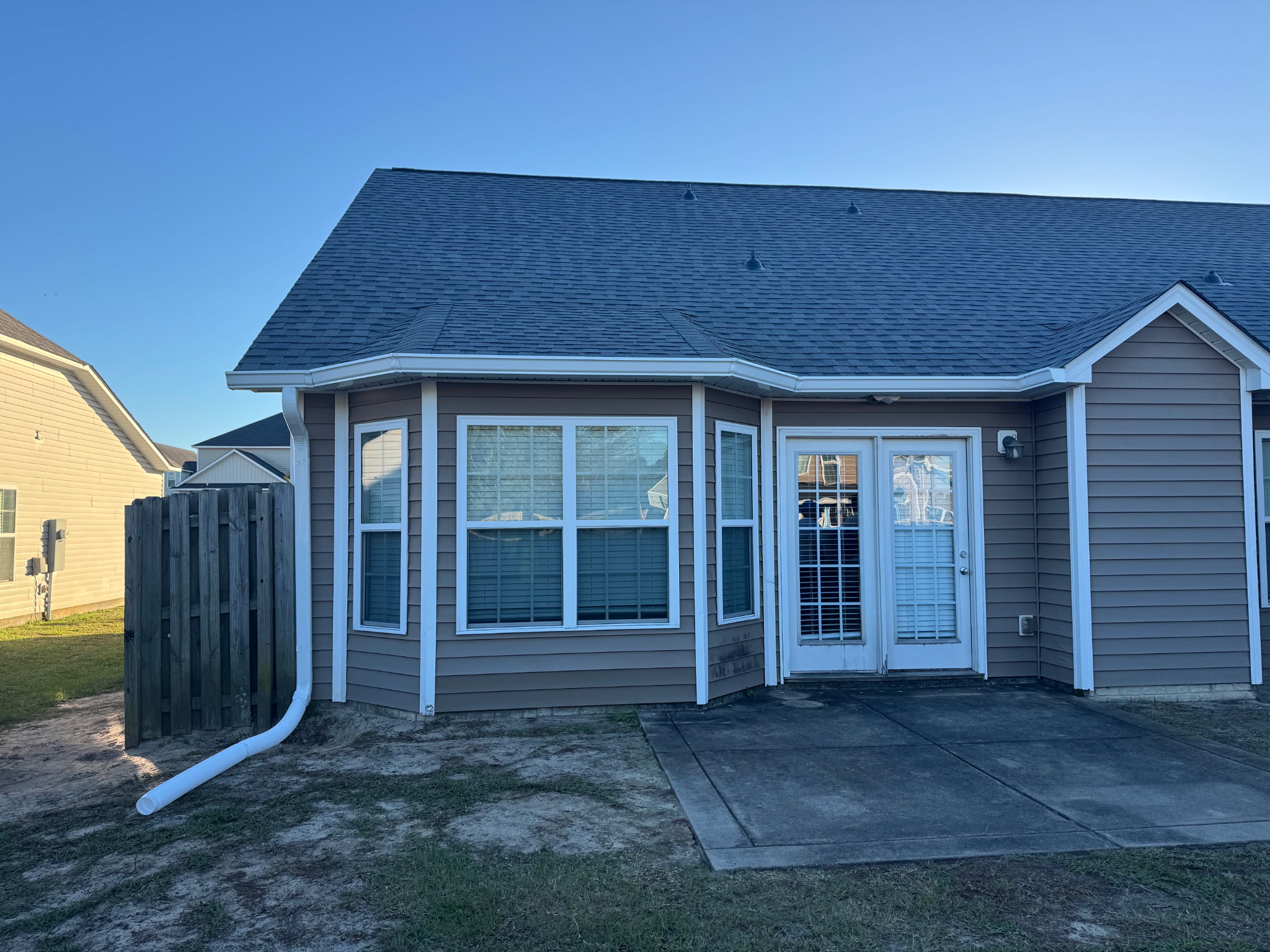 Seamless aluminum gutter installation on a residential home by BK Roofing