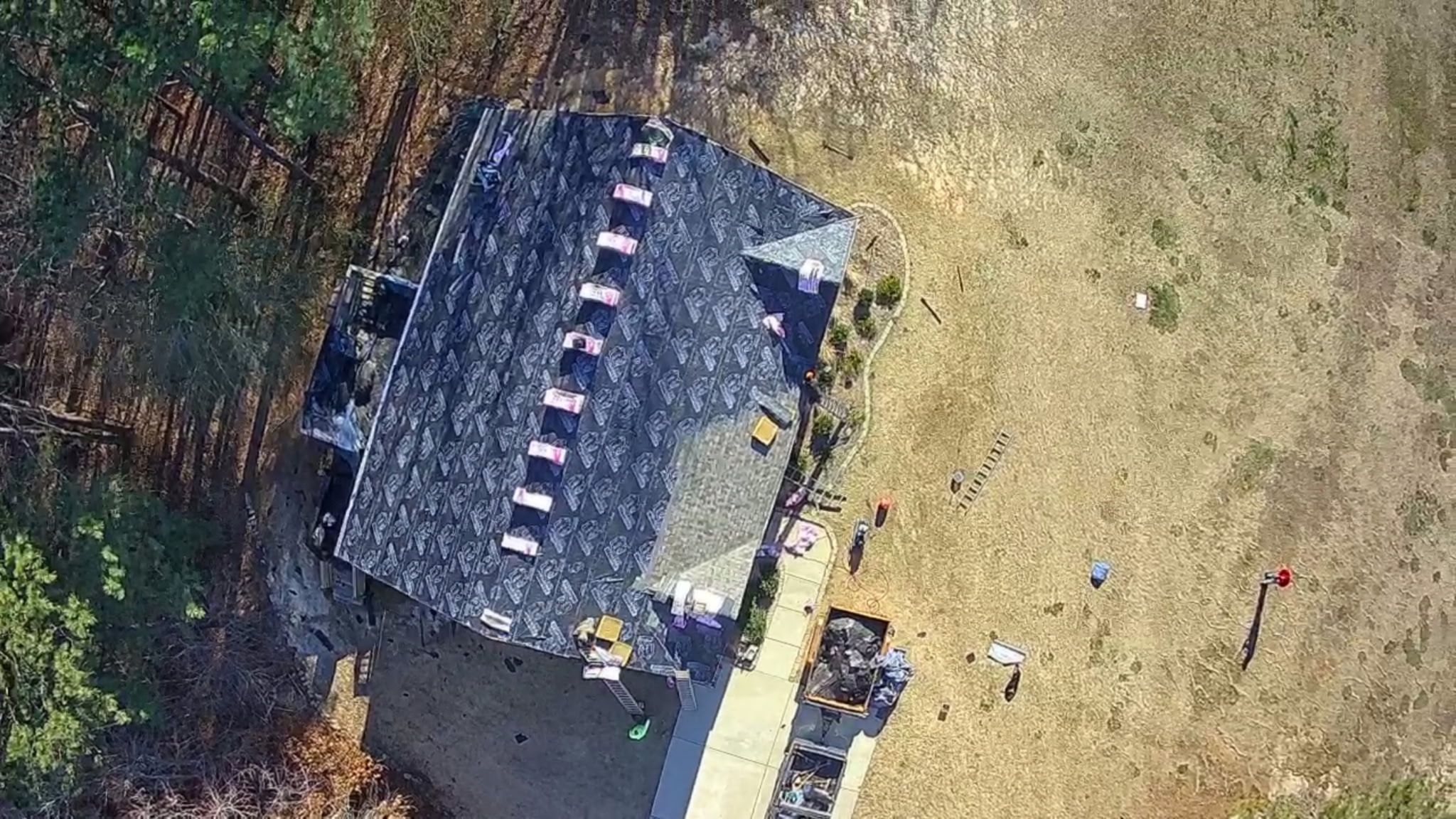 BK Roofing crew installing GAF architectural shingles on a two-story colonial home in Zebulon NC